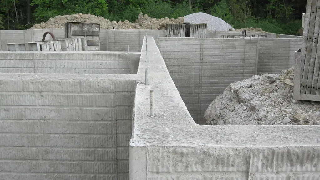 Poured concrete basement foundation walls before backfill.